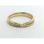 An 18ct gold twelve stone half eternity diamond ri