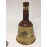 A bottle of unopened Bells whisky Old Scotch Speci