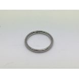 An unmarked ring, possibly white gold or platinum,