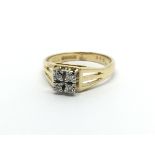 An 18carat gold ring setvwith a square of four bri