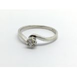 A 9ct white gold solitaire diamond ring, aporox .1