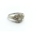 A 14ct white gold diamond cluster ring, approx .33