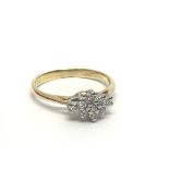 An 18ct gold nine stone diamond cluster ring, appr