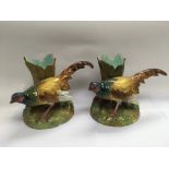 A pair of French Jerome Massier figural vases depicting vases, approx height 21cm.