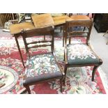 A Mahogany reading table with hinged flap and a pair of early Victorian saber leg chairs (3)