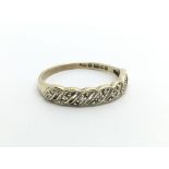 A small 9ct gold half eternity diamond ring, appro