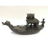 An Oriental bronze boat decorated with figures, ap