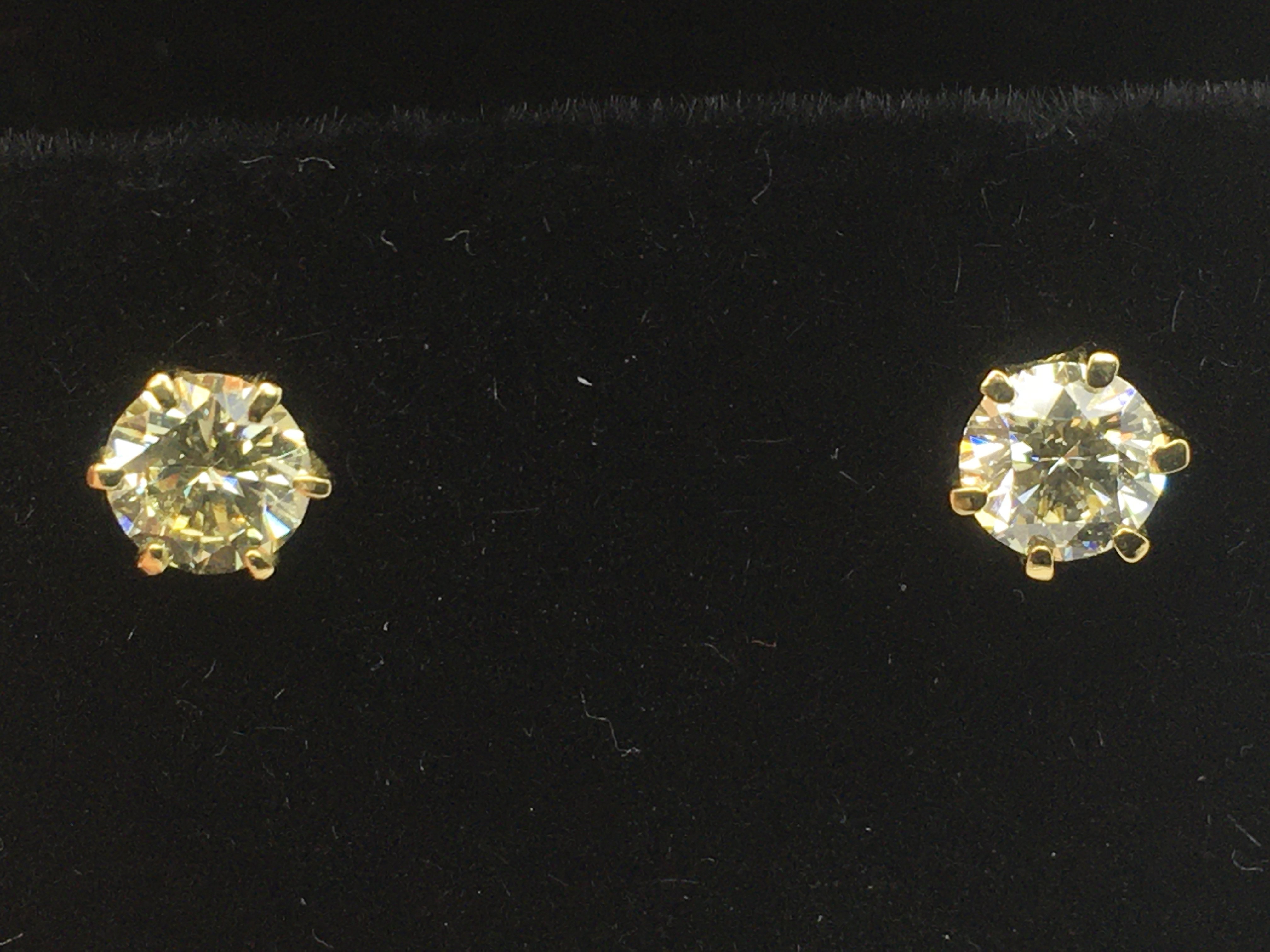 A pair of boxed 18ct yellow gold diamond solitaire