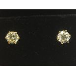 A pair of boxed 18ct yellow gold diamond solitaire