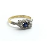An 18carat gold and platinum ring set with a blue