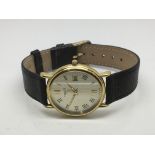 An 18ct gold cased gents Tissot watch.