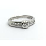 A 9ct white gold ten point solitaire diamond ring