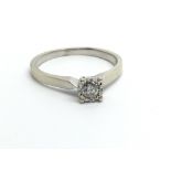 A 9ct white gold solitaire diamond ring, approx .1