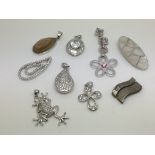 Nine silver pendants including one in the form of