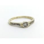 A 9ct gold ten point solitaire diamond ring, appro