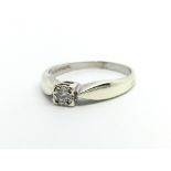 A 9ct white gold solitaire diamond ring, approx 1.