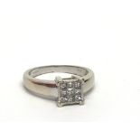 An 18ct white gold nine stone diamond ring set wit