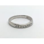 An 18ct white gold seven stone diamond ring, appro