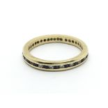 An 18carat gold eternity ring set with a row of al