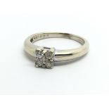 An 18ct white gold ring set with four diamonds and