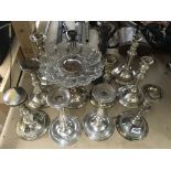 A collection of silver plated candlesticks and comport stands.