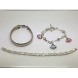 Three silver bracelets, one set with glass and met