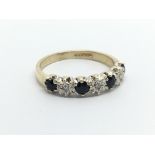 A 9carat gold ring set with alternating sapphire a
