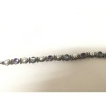 A silver (925) bracelet set with amethyst Colour a