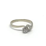 A 14ct white gold ring set with two diamonds, appr