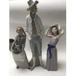 Three Lladro figures together with four others .
