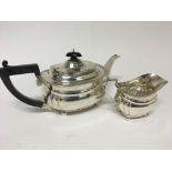 A silver tea pot maker Mappin & Webb and a conform