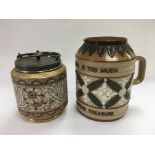 A Doulton Lambeth jug and a ceramic biscuit barrel