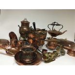 A collection of copper ware including a kettle on