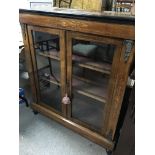 A Victorian inlaid walnut pier cabinet with gilt m