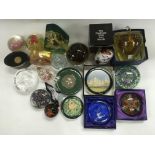 A collection of approx 20 glass paperweights.