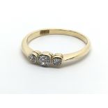 An 18carat gold ring set with three brilliant cut