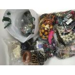 A collection of costume jewellery in a large bag.