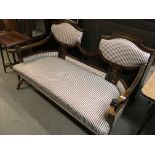 An inlaid Rosewood Edwardian open arm sofa with a