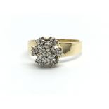 An 18ct gold diamond cluster ring, approx 2.7g and