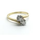 An 18carat yellow gold ring two diamond crossover