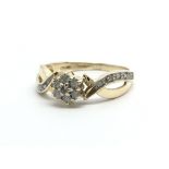 A 9ct gold diamond cluster ring, approx 2.2g and a