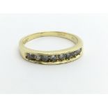 An 18ct gold half eternity diamond ring, approx.33