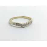 A small 9ct gold wishbone diamond ring, approx 1.4