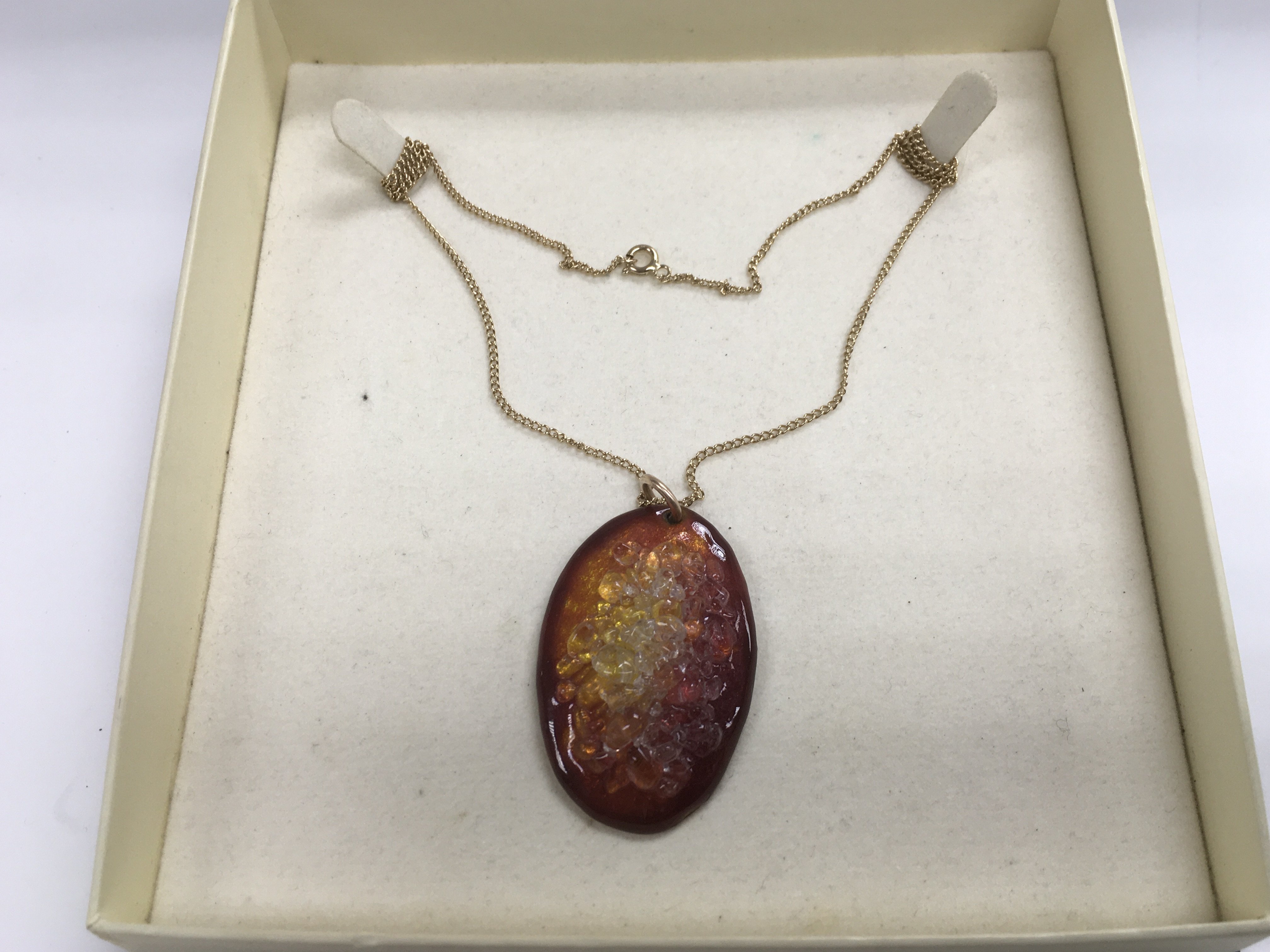 A signed Limoges enamel pendant on a 9ct gold chai