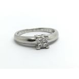 A platinum ring set with four princess cut diamond