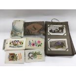 A collection of antique greetings cards, postcards