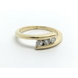 An 18ct gold three stone diamond ring, approx 1/4c