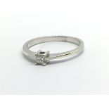 A 9ct white gold solitaire diamond ring set with a