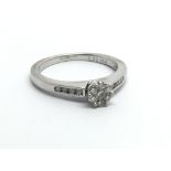 An 18carat white gold ring set with a pattern of b