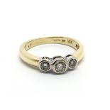 An 18carat gold ring set with three brilliant diam